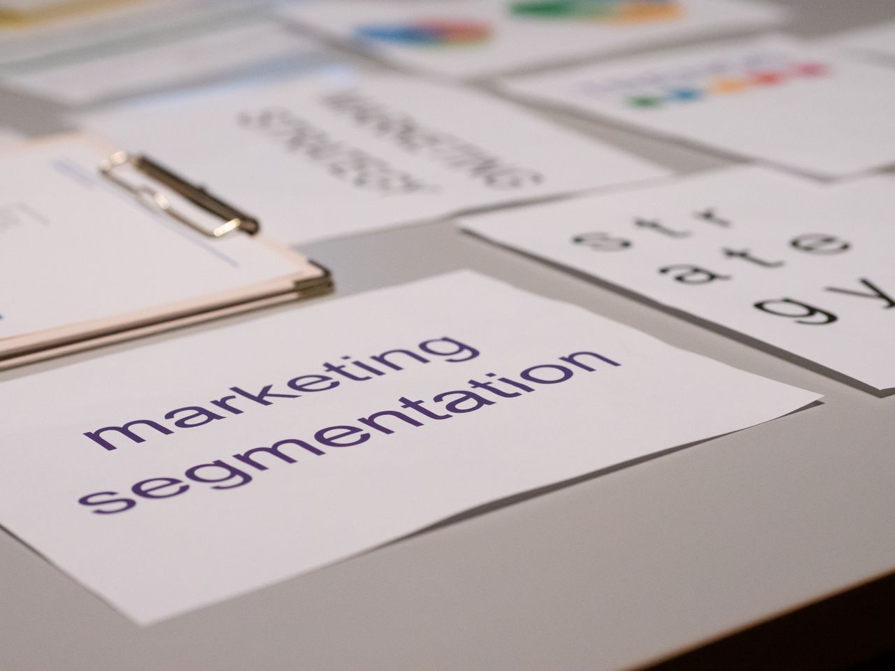 services-03 Close-up of various marketing documents on a desk, perfect for business and strategy discussions.
